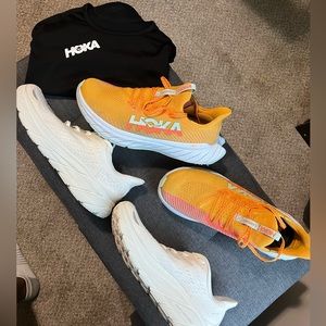 Hoka Bundle/Lot 2 pairs of Hoka Sneakers sz 11 & one black Hoka T shirt sz M